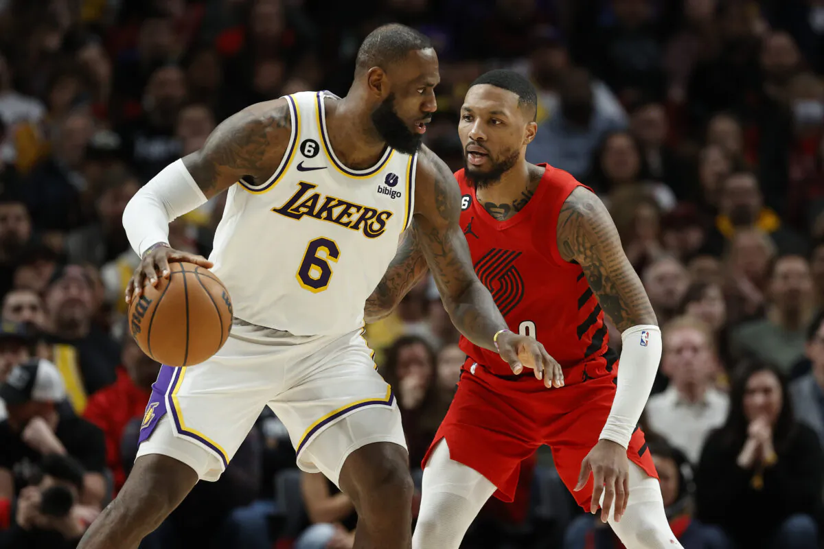 LeBron James (6) of the Los Angeles Lakers dribbles against Damian Lillard (0) of the Portland Trail Blazers during the fourth quarter at Moda Center in Portland on Jan. 22, 2023. (Steph Chambers/Getty Images)