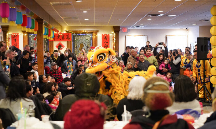 Lion dance performance during the Chinese New Year celebration at the Erie Trackside Manor in Port Jervis, N.Y., on Jan. 22, 2023. (Cara Ding/The Epoch Times)