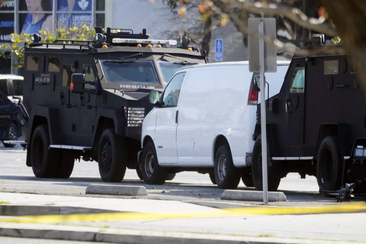 A van is surrounded by SWAT personnel in Torrance, Calif., on Jan. 22, 2023. (Damian Dovarganes/AP Photo)