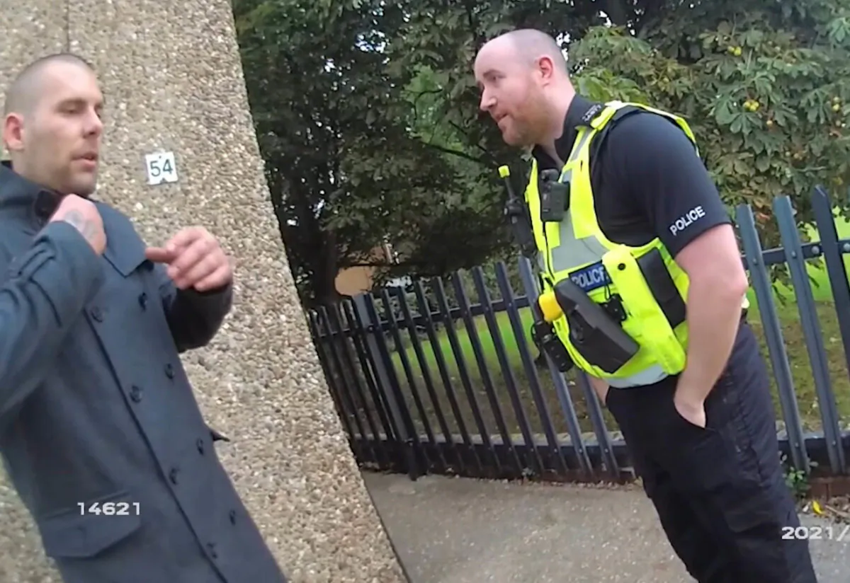 Undated still from a police bodyworn camera of police arresting Damien Bendall outside the house where he killed his girlfriend and three children in Killamarsh, Derbyshire, in September 2021. (Derbyshire Police)