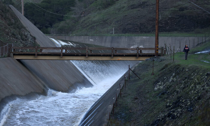 Water flows down the spillway at Nicasio Reservoir after days of rain have brought the reservoir to near capacity in Nicasio, Calif., on Jan. 9, 2023. (Justin Sullivan/Getty Images)