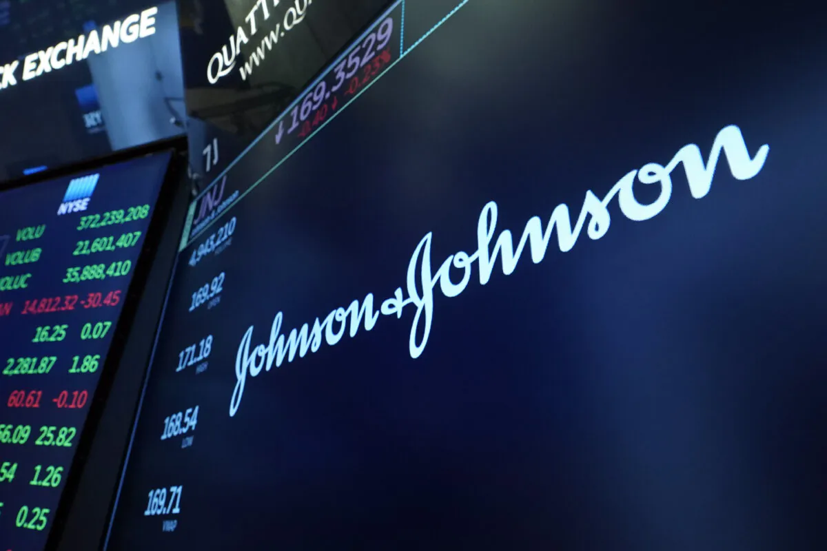 The Johnson & Johnson logo appears above a trading post on the floor of the New York Stock Exchange on July 12, 2021. (Richard Drew/AP Photo)