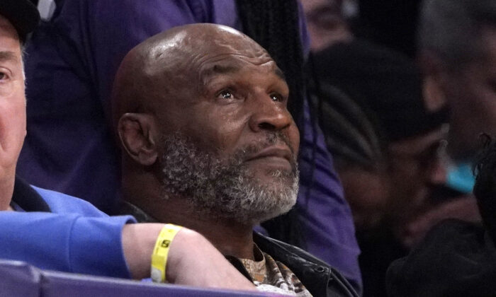 Mike Tyson watches the first half of an NBA basketball game between the Los Angeles Lakers and the New Orleans Pelicans in Los Angeles on Feb. 27, 2022. (Mark J. Terrill/AP Photo)