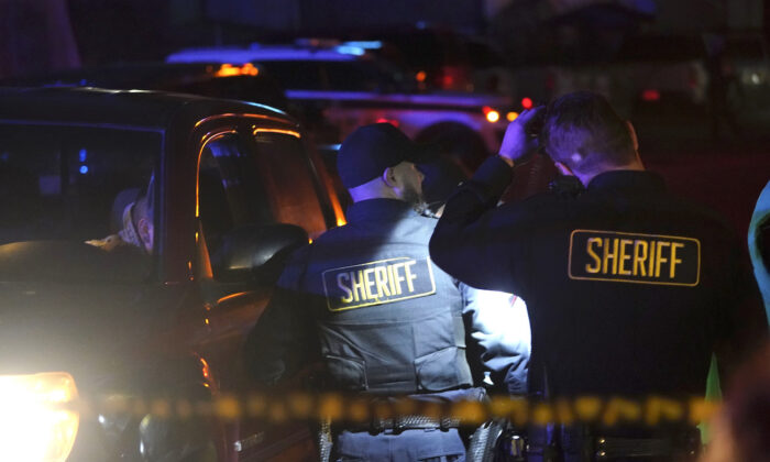 Law enforcement personnel control the scene of a shooting in Half Moon Bay, Calif., on Jan. 23, 2023. (Jeff Chiu/AP Photo)