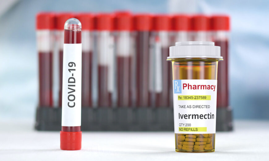 An ivermectin bottle next to a positive blood sample of COVID-19. (Novikov Aleksey/Shutterstock)