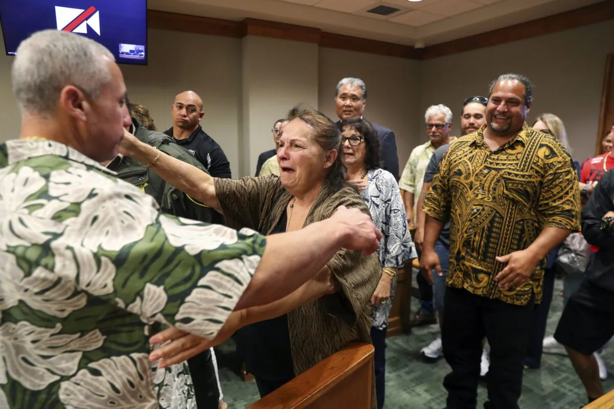 Albert "Ian" Schweitzer (L) hugs his mother, Linda, moments after a judge ordered him released from prison in Hilo, Hawaii, on Jan. 24, 2023. (Marco Garcia/The Innocence Project via AP Images)