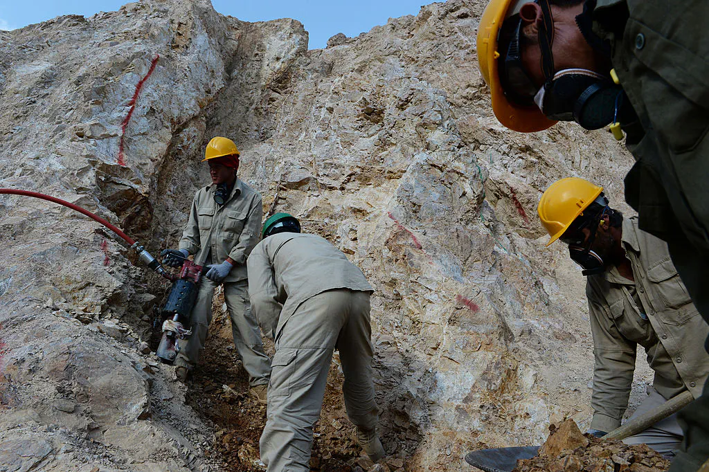 Afghan miners work at a gold mine on a mountainside near the village of Qara Zaghan in Baghlan province on May 6, 2013. (Shah Marai/AFP via Getty Images)