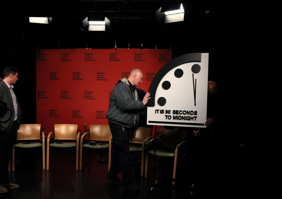 The clock with the Bulletin of the Atomic Scientists is being placed at a TV studio ahead of the announcement of the location of the minute hand on its Doomsday Clock, indicating what world developments mean for the perceived likelihood of nuclear catastrophe, at the National Press Club in Washington on Jan. 24, 2023. (Leah Millis/Reuters)
