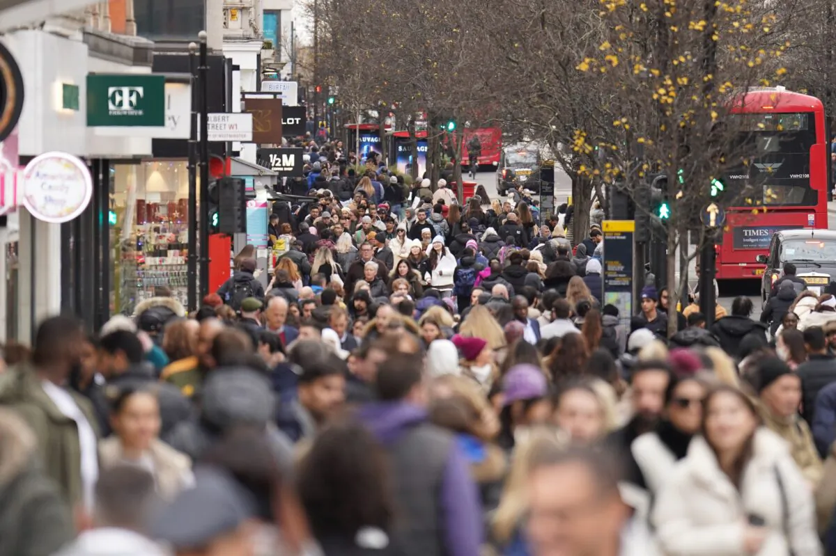 People shopping on Oxford Street in London, on Dec. 27, 2022. (James Manning/PA Media)