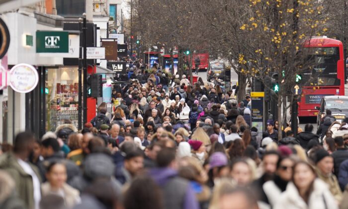 People shopping on Oxford Street in London, on Dec. 27, 2022. (James Manning/PA Media)