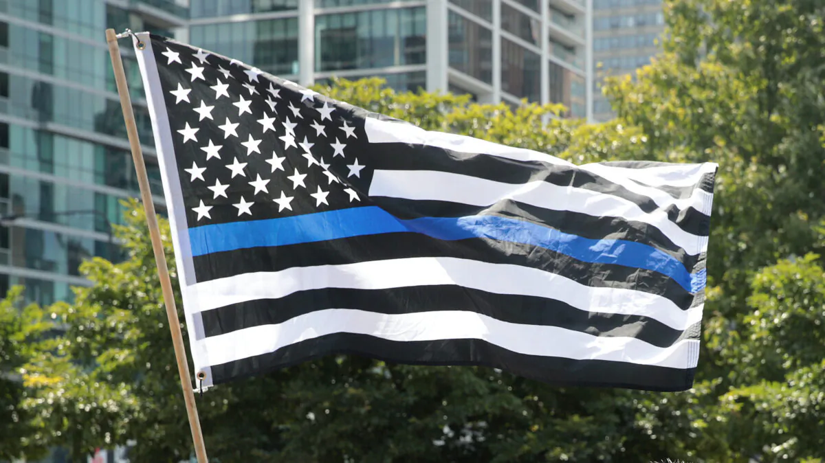 A Thin Blue Line flag flies at a rally in Grant Park in Chicago on July 25, 2020. (Scott Olson/Getty Images)