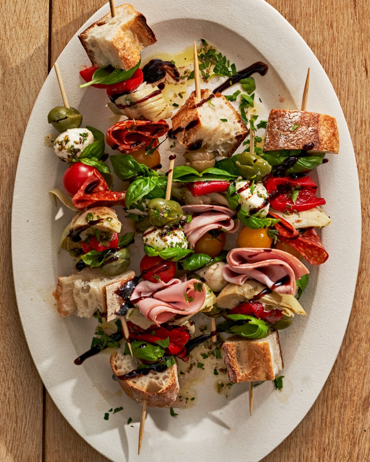 Creamy marinated mozzarella, savory meats, marinated vegetables, plump ripe tomatoes, and fresh herbs come together for the perfect appetizer. (Andrew Bui/TNS)