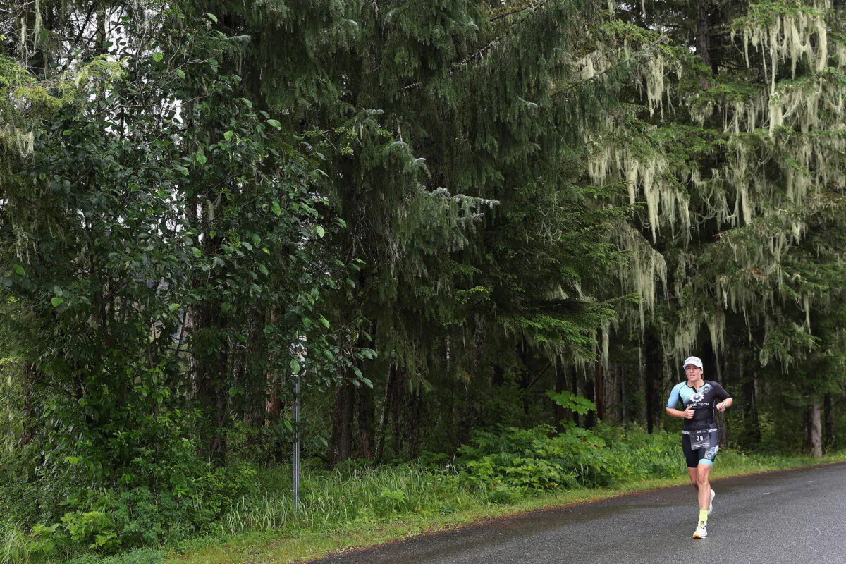 A competitor takes part in the run portion of IRONMAN Alaska in Juneau, Alaska, on Aug. 7, 2022. (Christian Petersen/Getty Images for IRONMAN)