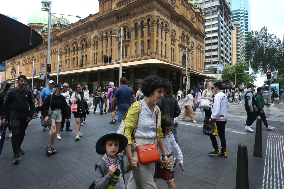 Pedestrians move along George Street in Sydney, Australia, on Oct. 22, 2022. (Lisa Maree Williams/Getty Images)