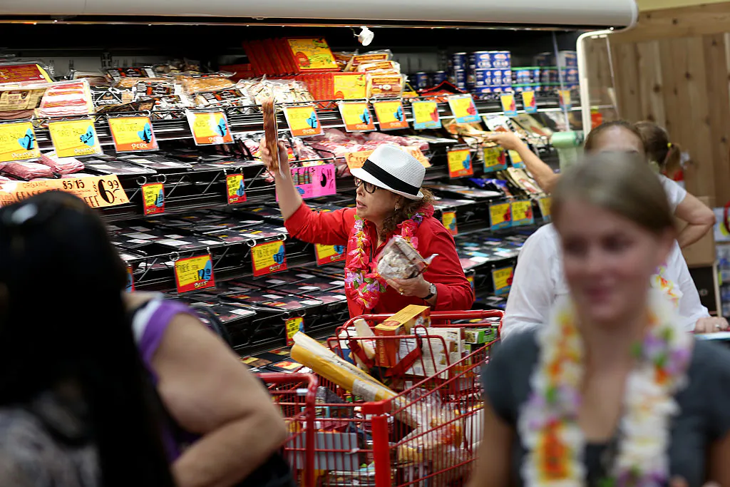 A customer shops in the meat section as she enjoys the grand opening of a Trader Joe's in Pinecrest, Fla., on Oct. 18, 2013. (Joe Raedle/Getty Images)