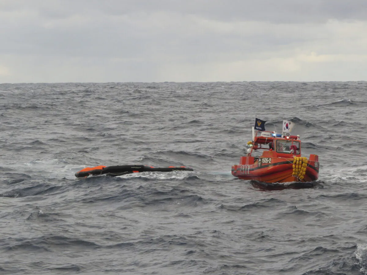 A South Korea coast guard vessel conducts a search operation in waters between South Korea and Japan on Jan. 25, 2023. (The Korea Coast Guard via AP)