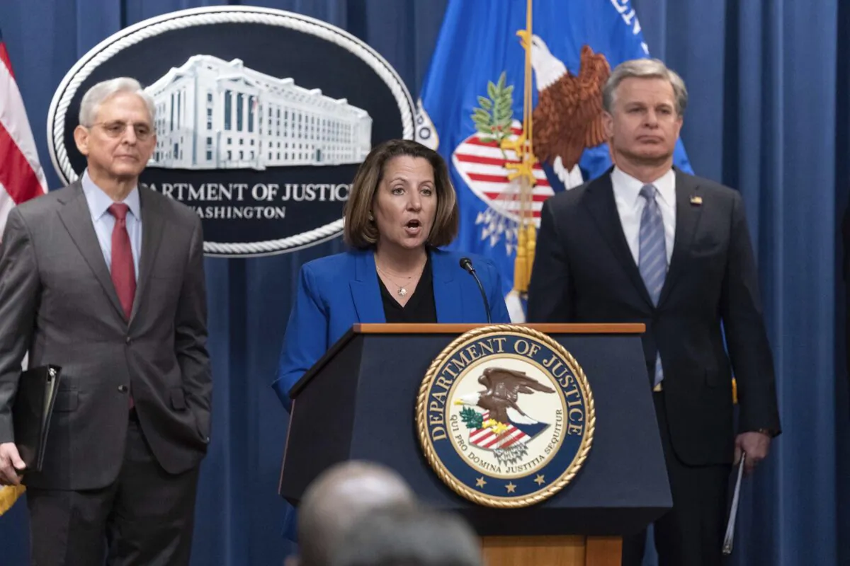Deputy Attorney General Lisa Monaco (C) flanked by Attorney General Merrick Garland (L) and FBI Director Christopher Wray (R) speaks during a news conference to announce an international ransomware enforcement action at the Department of Justice in Washington on Jan. 26, 2023. (Jose Luis Magana/AP Photo)