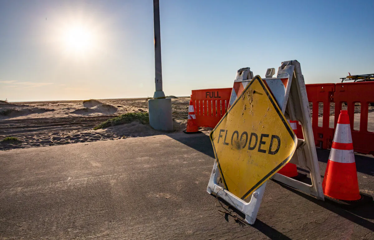 A road flooded sign was seen in a file photo. (John Fredricks/The Epoch Times)