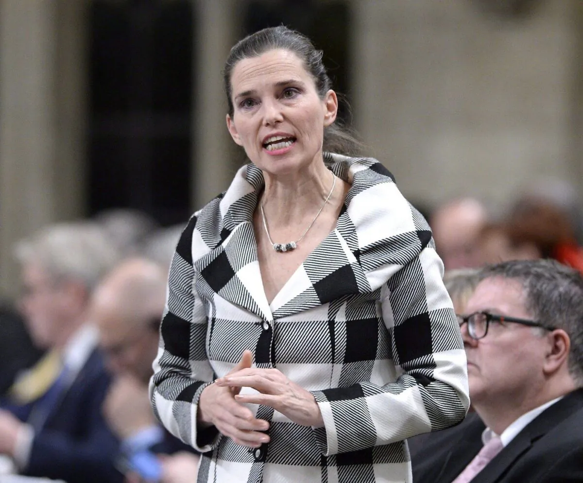 Minister of Science, Sport and Persons with Disabilities Kirsty Duncan rises during Question Period in the House of Commons on Parliament Hill in Ottawa on Mar. 1, 2018. (The Canadian Press/Justin Tang)
