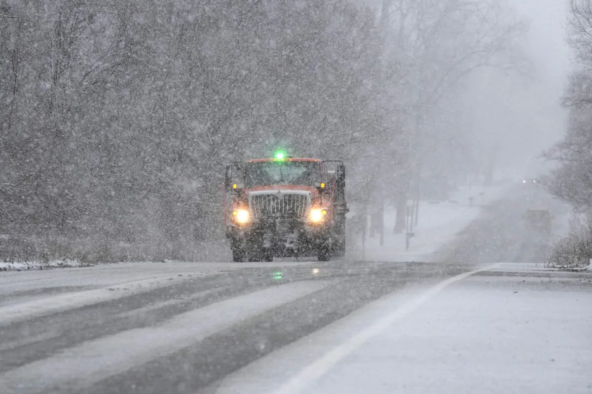 A Wayne County Department of Public Services truck salts a road in Wayne, Mich., on Jan. 25, 2023. (Carlos Osorio/AP Photo)