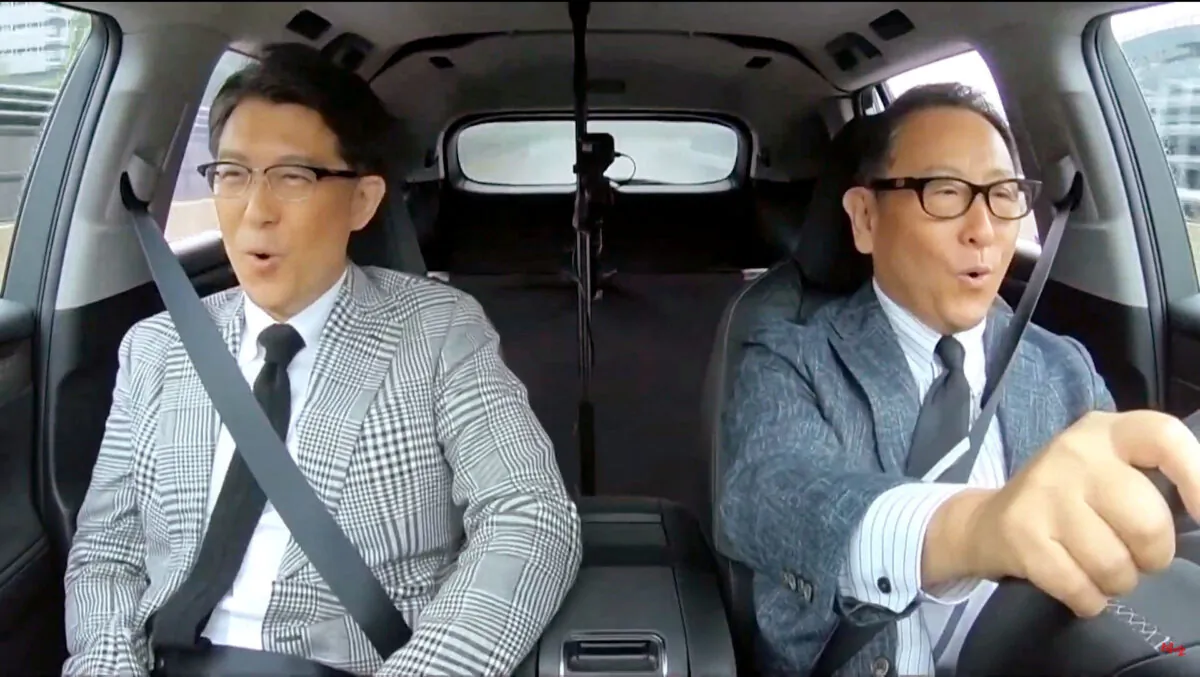 Toyota Motor Corp. President Akio Toyoda and Operating Officer Koji Sato test-riding Lexus's first electric vehicle model, RZ, in Japan in this photo provided on Jan. 26, 2023. (Kyodo/via Reuters)