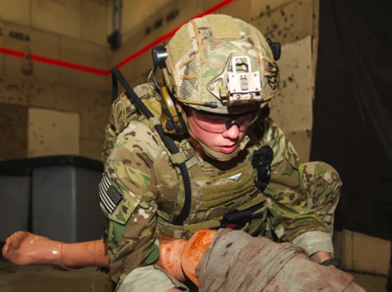 "Treat the Wound." (SGT Henry Villarama/Department of Defense)