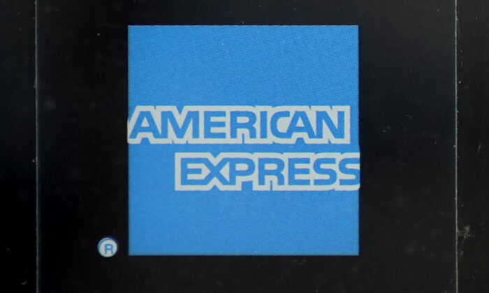 An American Express logo is attached to a door in Boston's Seaport District on July 21, 2021. (Steven Senne/AP Photo)