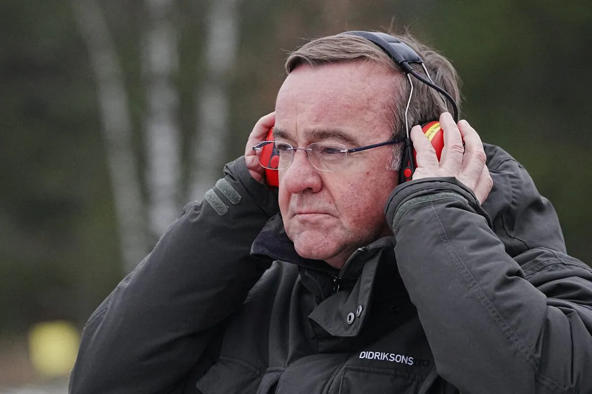 German Defence Minister Boris Pistorius puts on ear protection during firing practice at armoured infantry training area Altengrabow, Germany, on Jan. 26, 2023. (Kay Nietfeld/Pool via Reuters)