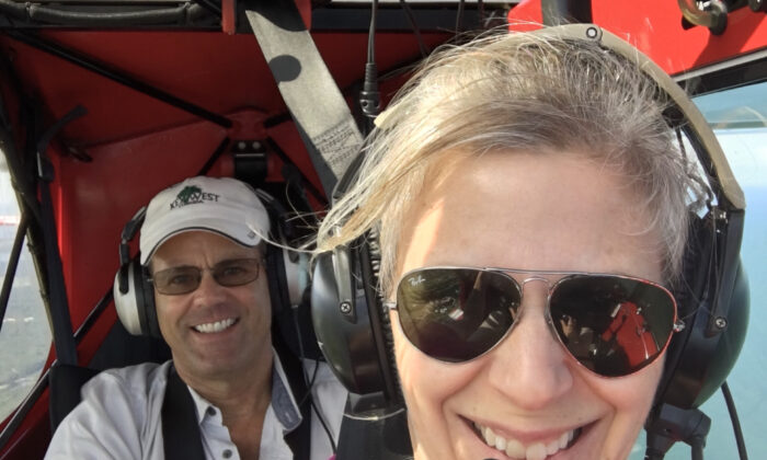 Dana Holladay (L) and his wife, Meredith, of Holladay Aviation, fly their plane in Jacksonville, Florida, in August 2019. (Meredith Holladay)