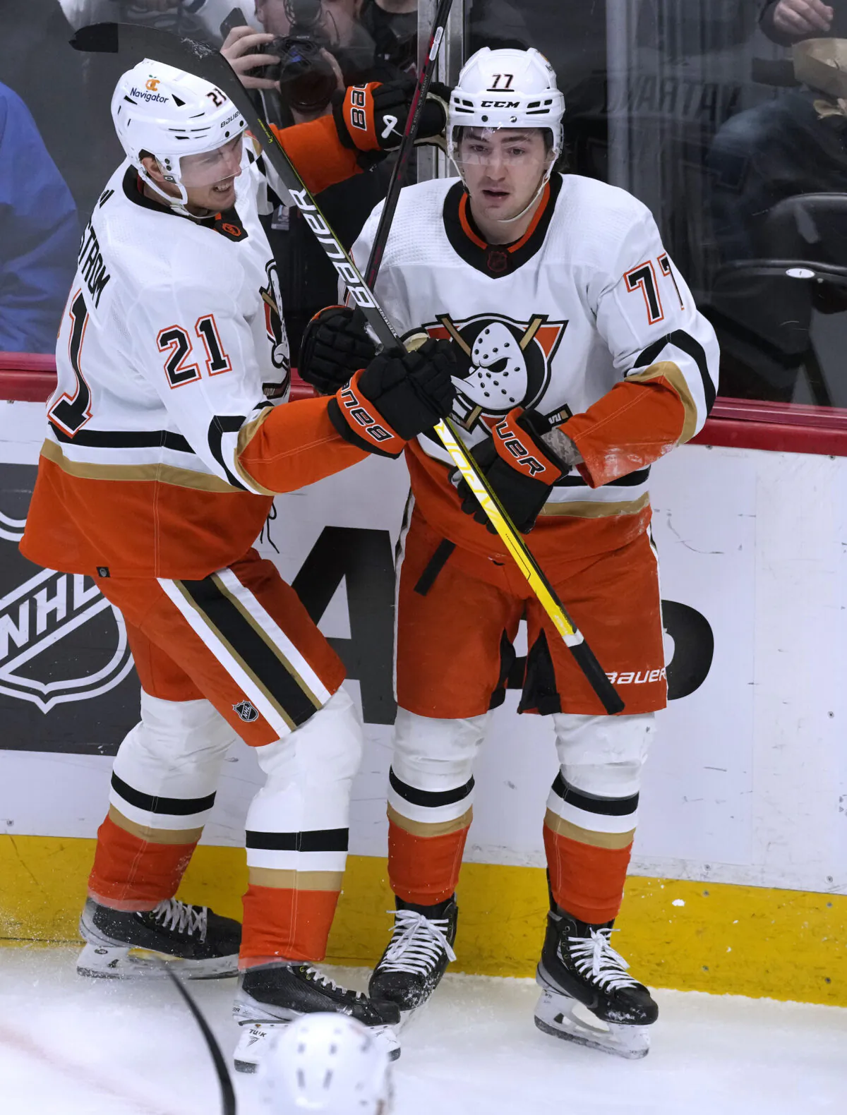 Anaheim Ducks center Isac Lundestrom, left, congratulates right wing Frank Vatrano, who scored against the Colorado Avalanche during the first period of an NHL hockey game in Denver on Jan. 26, 2023. (David Zalubowski/AP Photo)