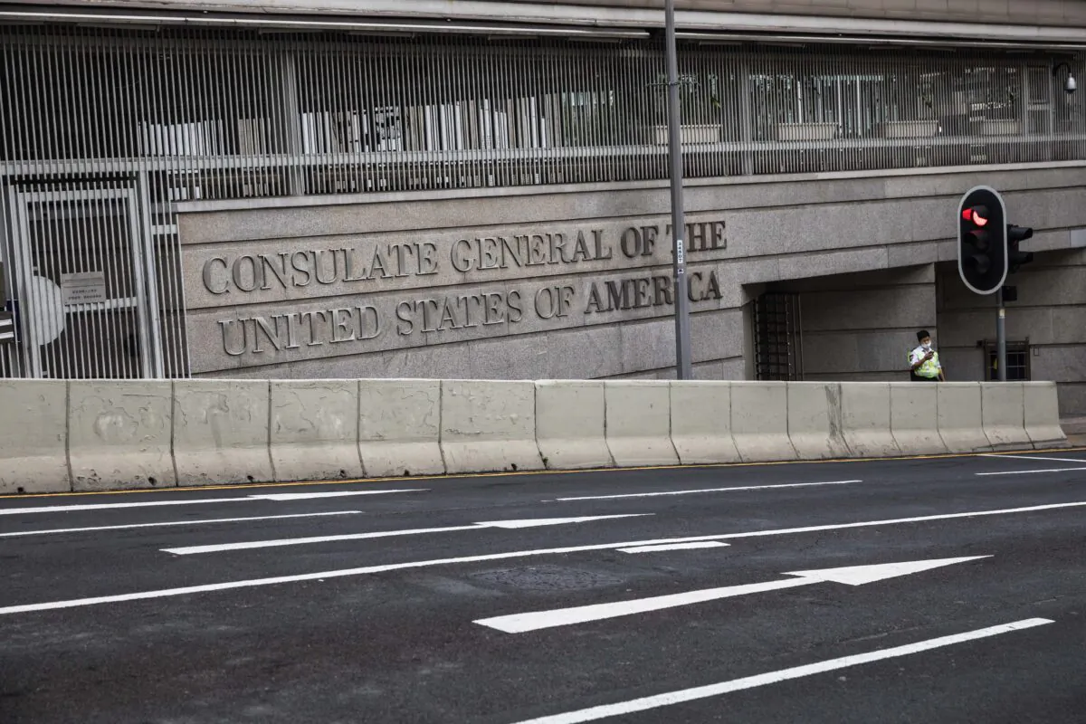 A security guard stands outside the U.S. consulate general building in Hong Kong on Sept. 12, 2020. (Dale De La Rey/AFP via Getty Images)