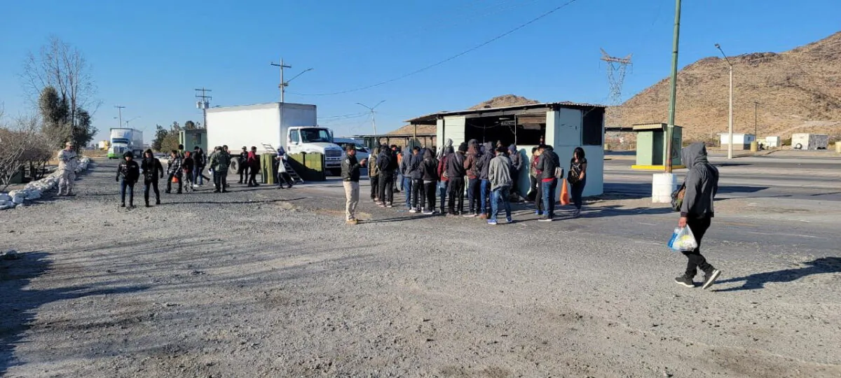 Guatemalan unaccompanied minors who were traveling in a crowded truck are seen with Mexican authorities after being spotted at a checkpoint in Ciudad Juarez, Mexico, in this handout picture distributed to Reuters on Jan. 26, 2023. (Mexico's National Institute of Migration (INM)/Handout via Reuters)