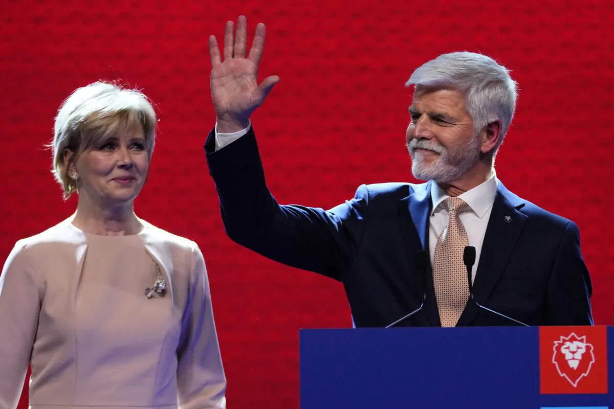Czech Republic's President-elect Petr Pavel with his wife Eva greets his supporters after announcement of the preliminary results of the presidential runoff in Prague, Czech Republic, on Jan. 28, 2023. (Petr David Josek/AP Photo)