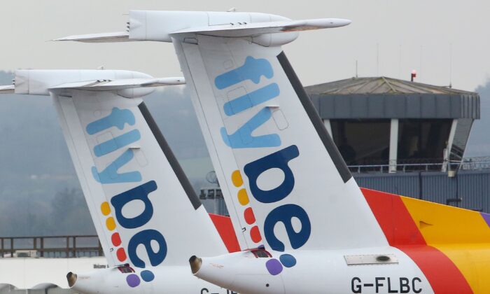 Flybe aircraft are pictured on the tarmac at Exeter airport in Exeter, south-west England on March 5, 2020. (Geoff Caddick/AFP via Getty Images)