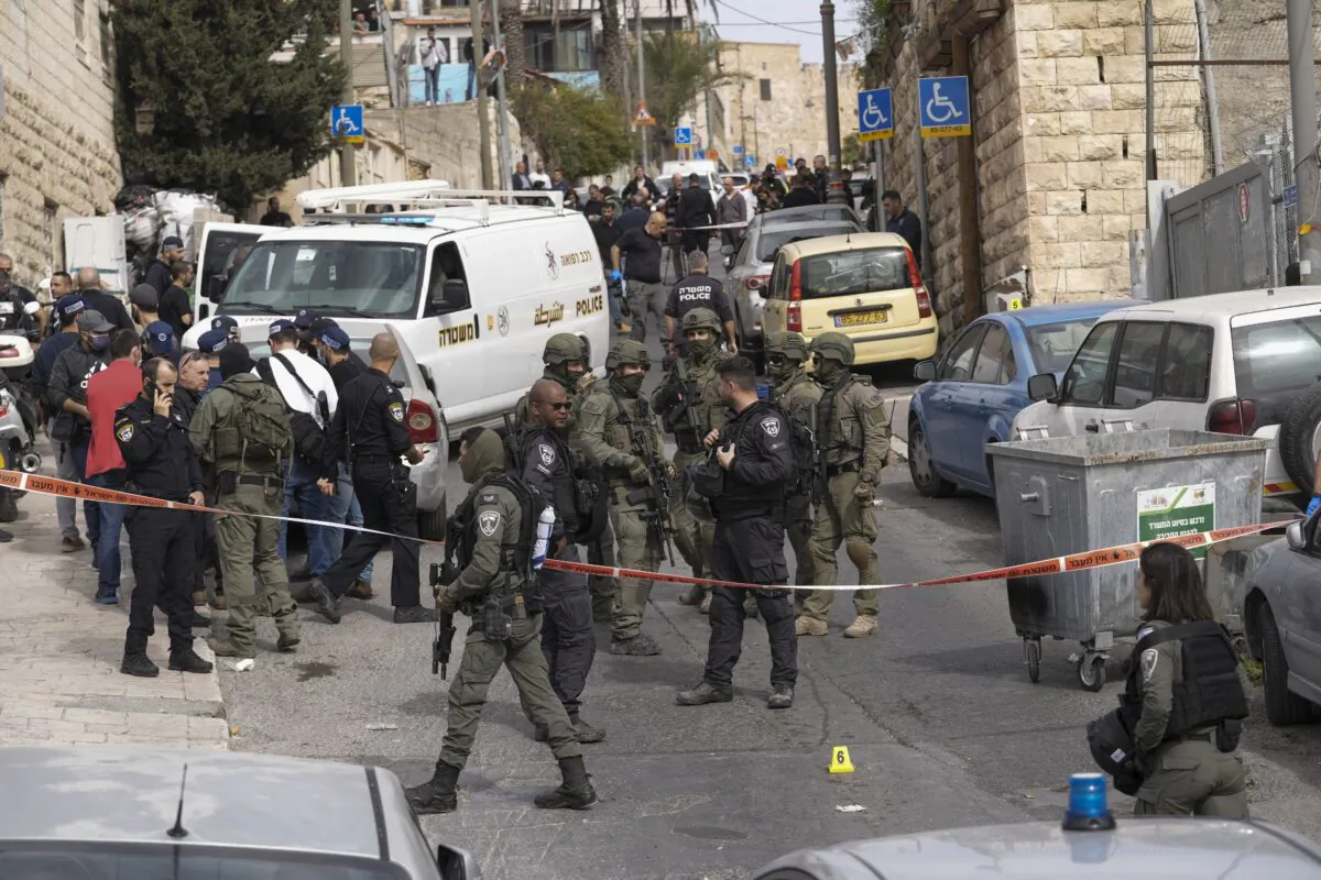 An Israeli policeman secures a shooting attack site in east Jerusalem on Jan. 28, 2023. (Mahmoud Illean/AP Photo)