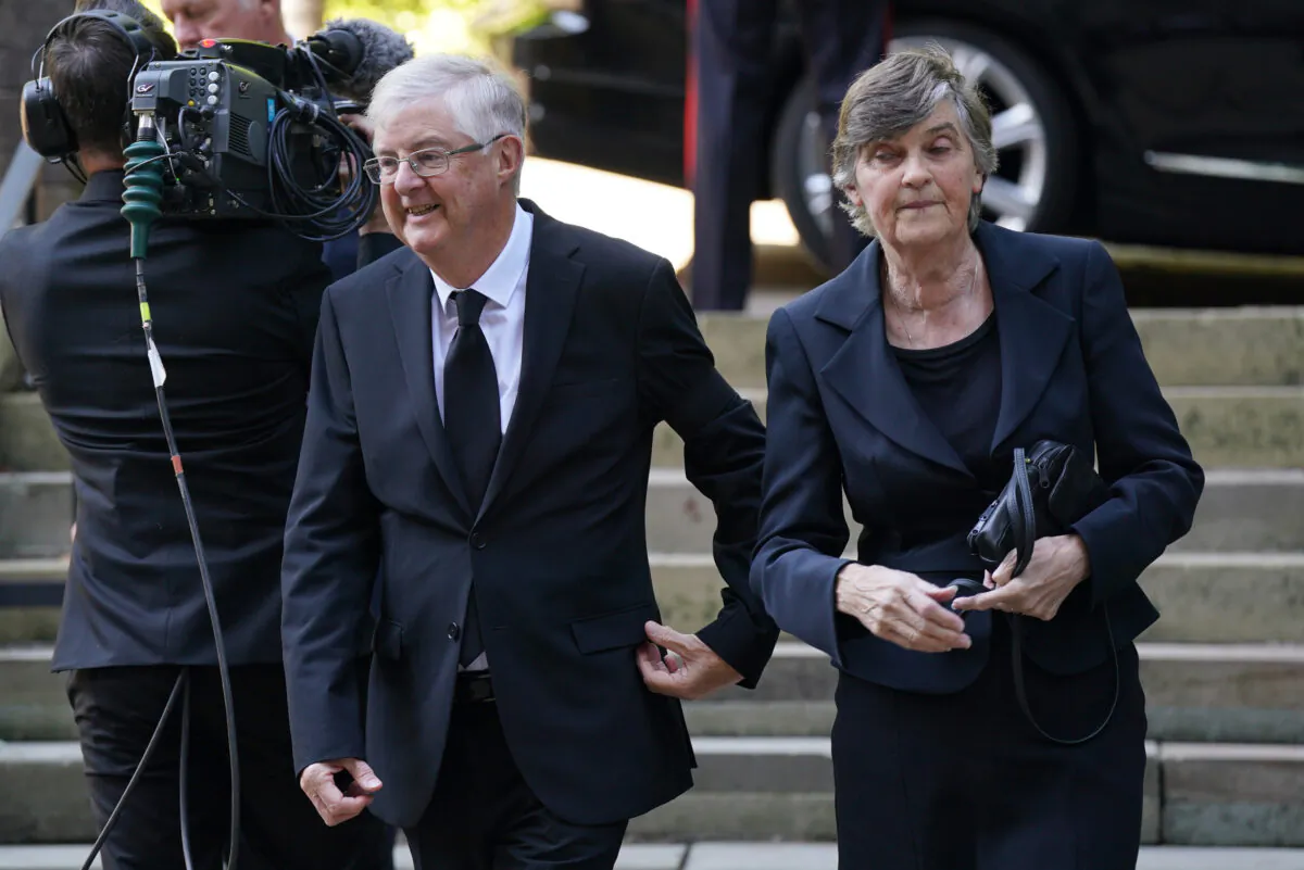 Wales's First Minister Mark Drakeford and wife Clare arriving at Llandaff Cathedral in Cardiff, for a Service of Prayer and Reflection for the life of Queen Elizabeth II, on Sept. 16, 2022. (Jacob King/PA Media)