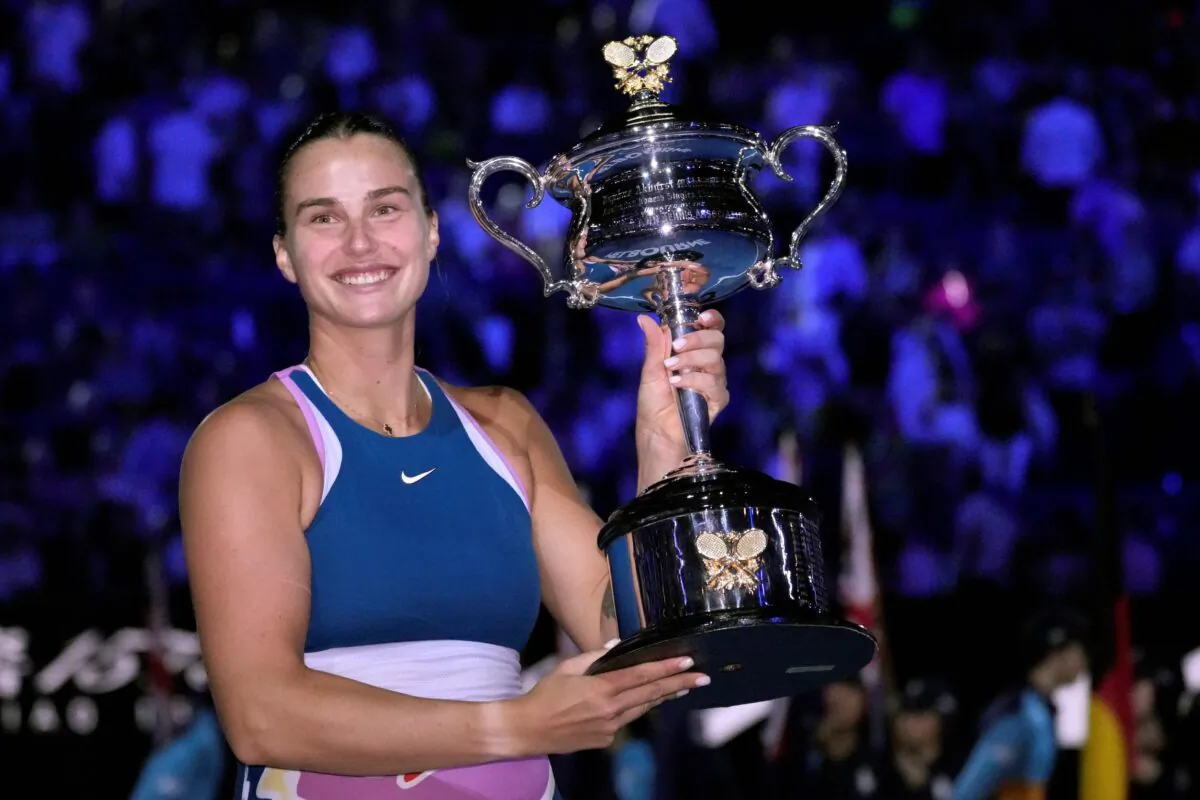 Aryna Sabalenka of Belarus holds the Daphne Akhurst Memorial Trophy after defeating Elena Rybakina of Kazakhstan in the women's singles final at the Australian Open tennis championship in Melbourne, Australia, on Jan. 28, 2023 (Aaron Favila/AP Photo)