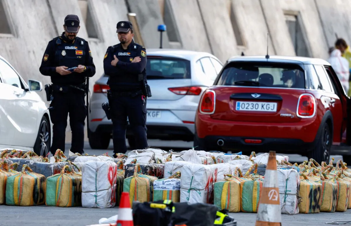 Police officers discharge drugs from the cattle ship Orion V that was seized off the Canary Islands, in the port of Las Palmas, in the island of Gran Canaria, Spain, on Jan. 26, 2023. (Borja Suarez/Reuters)
