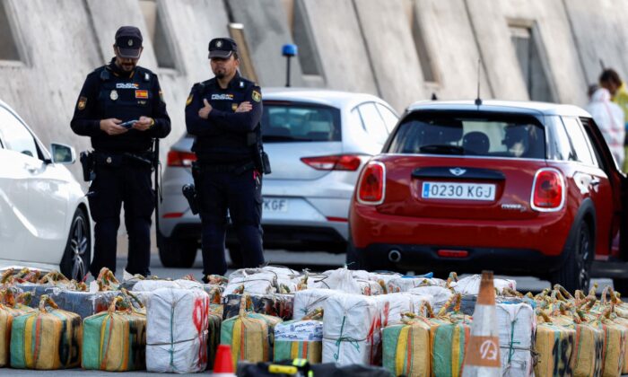 Police officers discharge drugs from the cattle ship Orion V that was seized off the Canary Islands, in the port of Las Palmas, in the island of Gran Canaria, Spain, on Jan. 26, 2023. (Borja Suarez/Reuters)