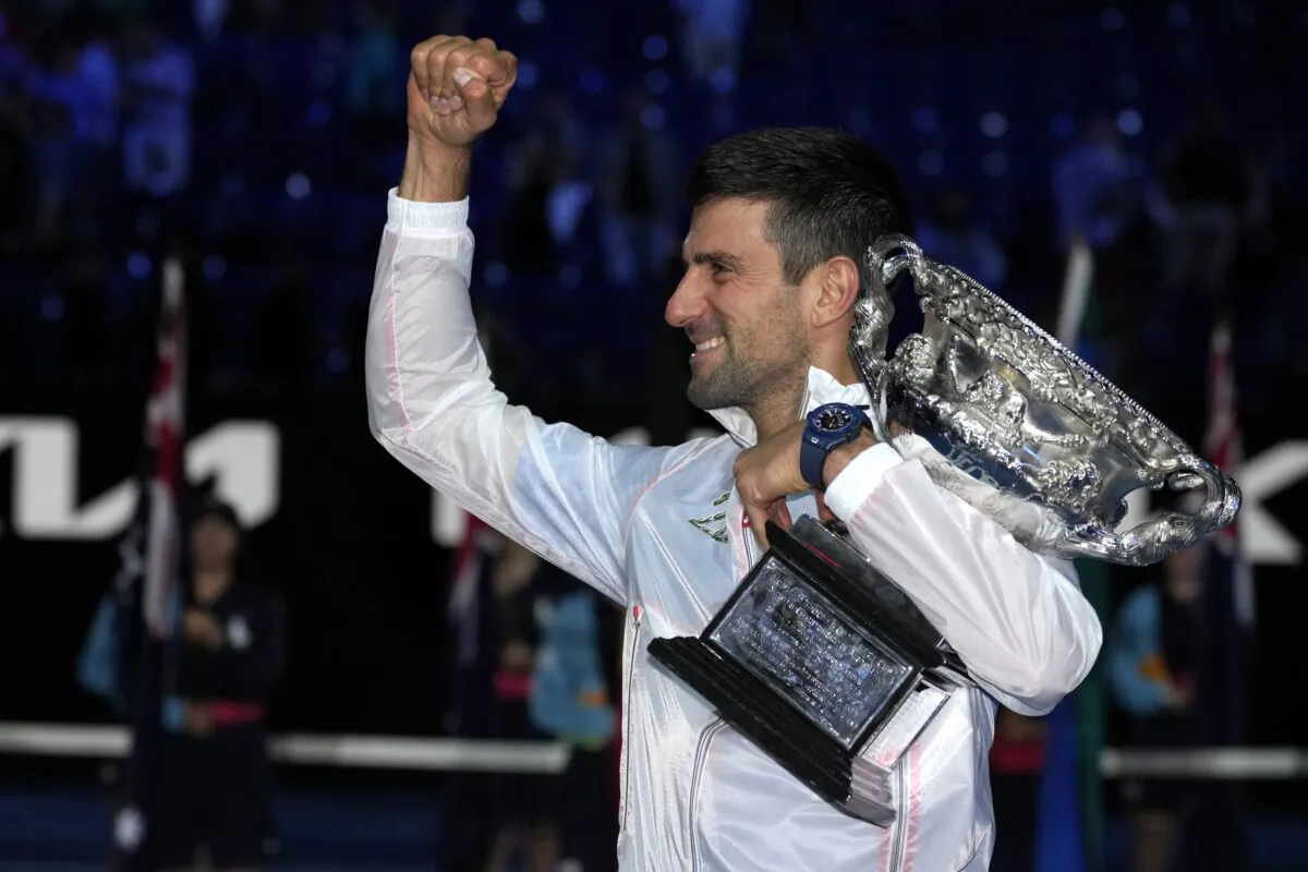 Novak Djokovic of Serbia gestures as he holds the Norman Brookes Challenge Cup after defeating Stefanos Tsitsipas of Greece in the men's singles final at the Australian Open tennis championship in Melbourne, Australia, on Jan. 29, 2023. (Aaron Favila/AP Photo)