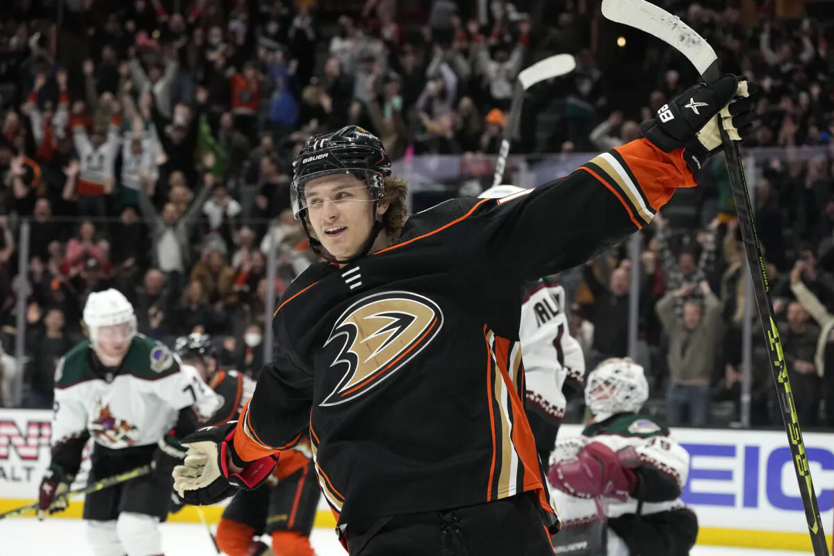 Anaheim Ducks center Trevor Zegras, center, celebrates his overtime goal in an NHL hockey game against the Arizona Coyotes in Anaheim, Calif., Jan. 28, 2023. (Mark J. Terrill/AP Photo)