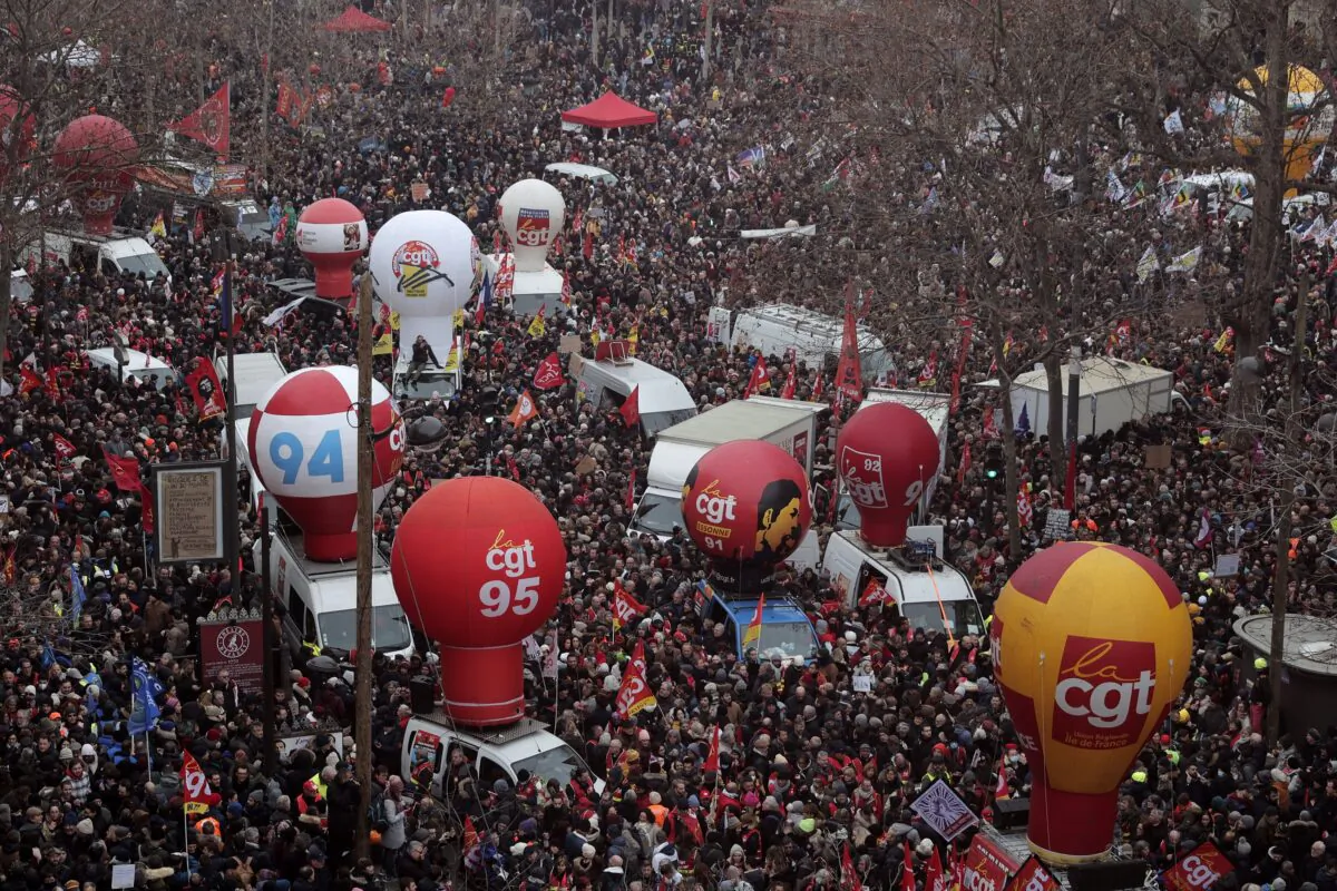 People gather on Place de la Republique during a demonstration against proposed pension changes in Paris on Jan. 19, 2023. (Lewis Joly/AP Photo)