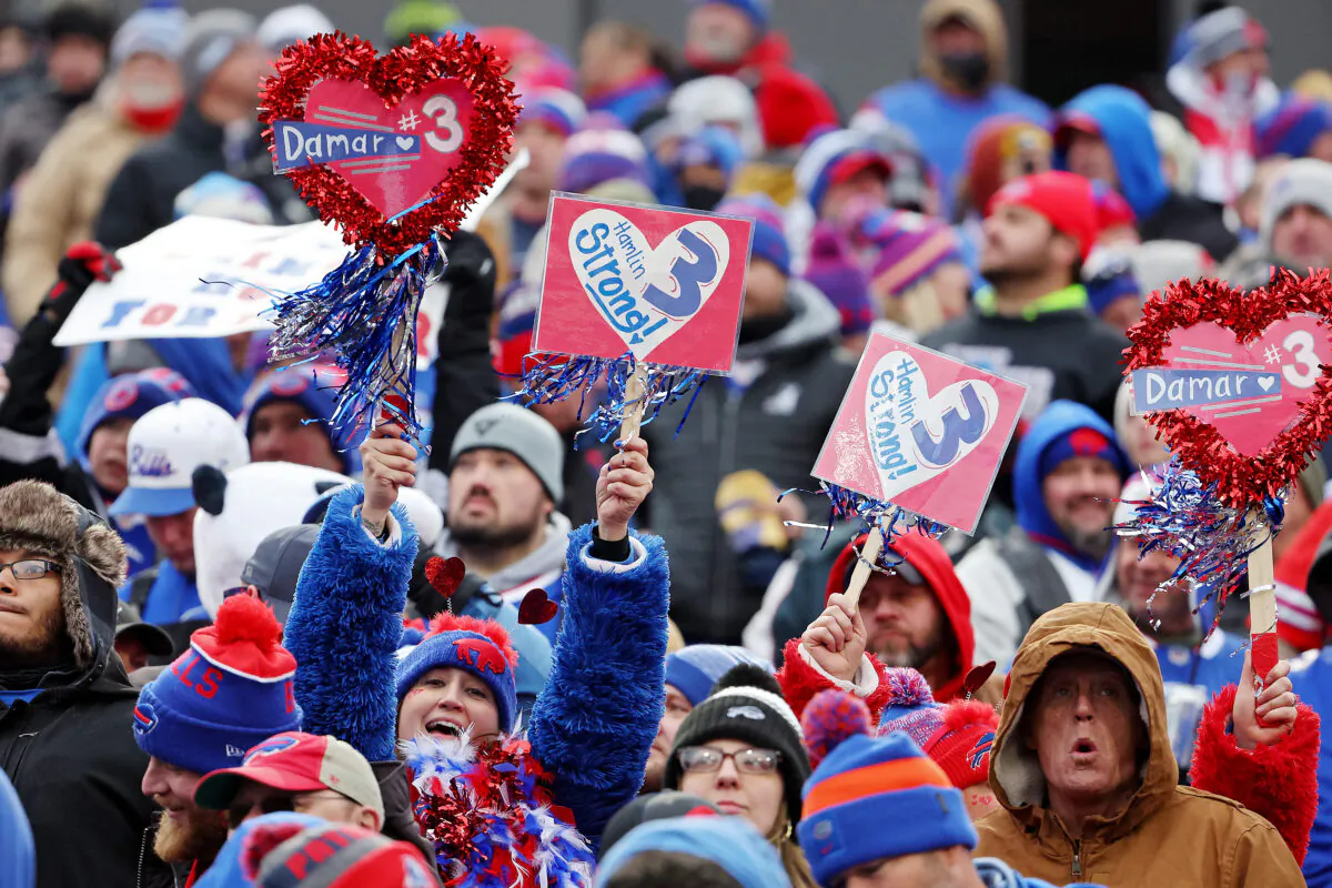 Fans hold signs in support of Buffalo Bills safety Damar Hamlin during a game against the New England Patriots at Highmark Stadium in Orchard Park, New York on Jan. 8, 2023. (Timothy T Ludwig/Getty Images)