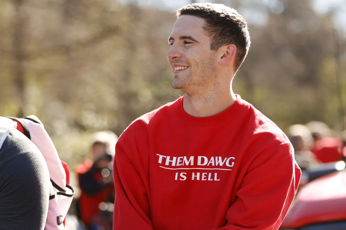 Georgia quarterback Stetson Bennett smiles at the crowd during a parade celebrating the Bulldog's second consecutive NCAA college football national championship, Saturday, Jan. 14, 2023, in Athens, Ga. (AP Photo/Alex Slitz)