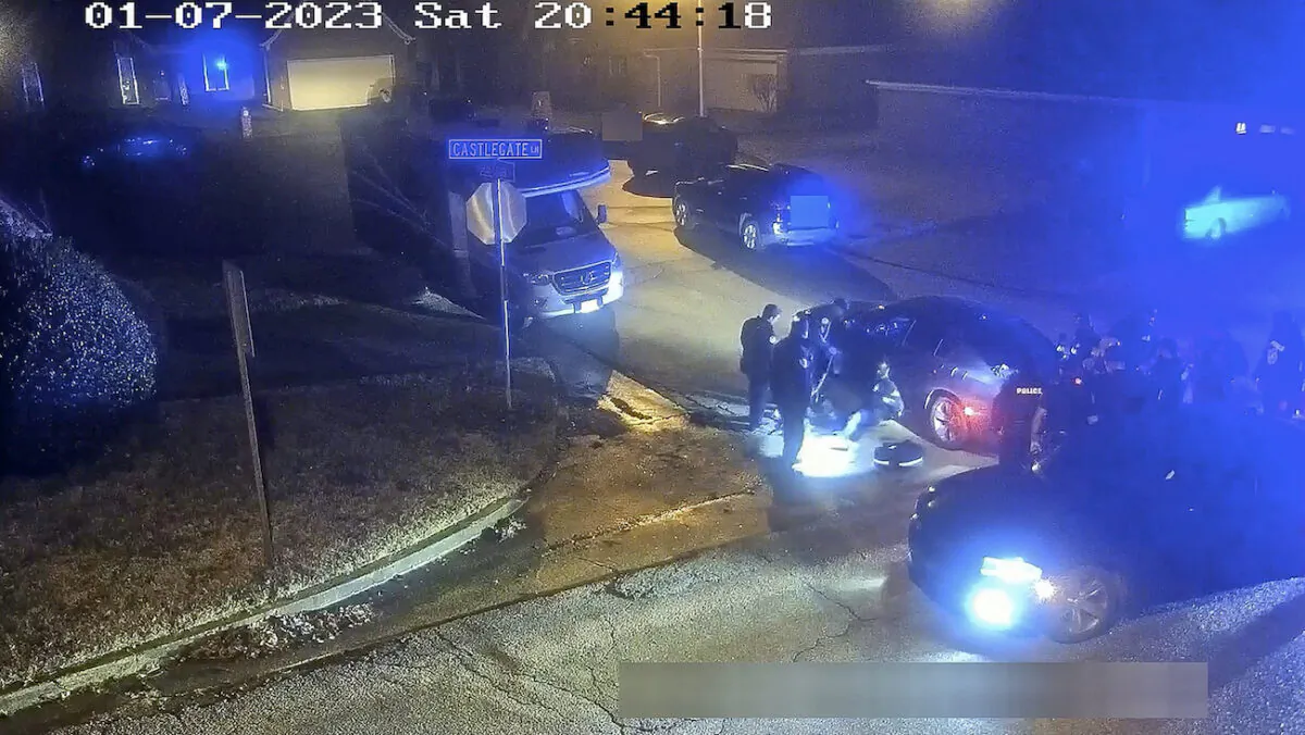 The image from video released on Jan. 27, 2023, Tyre Nichols seated leaning against a car during a brutal attack by five Memphis police officers in Memphis, Tenn., on Jan. 7, 2023. (City of Memphis via AP)