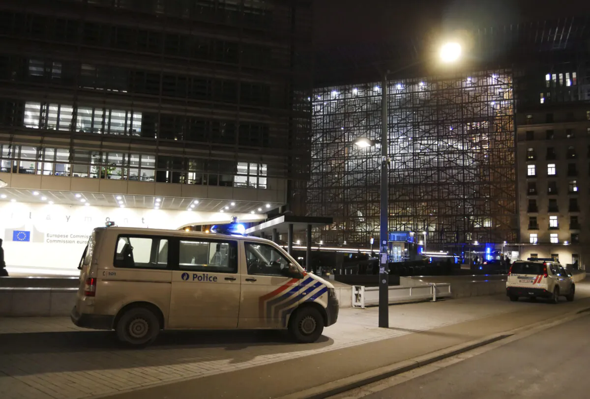 Police are parked as they cordon off an area near a metro station in front of EU headquarters in Brussels on Jan. 30, 2023. (Sylvain Plazy/AP Photo)