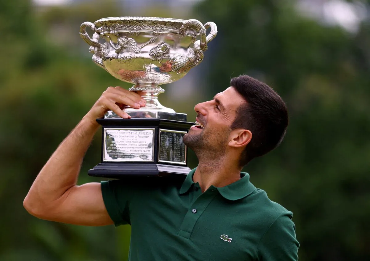 Serbia's Novak Djokovic poses with the trophy during Australian Open champion in Government House, Melbourne, Australia, on Jan. 30, 2023. (Carl Recine/Reuters)