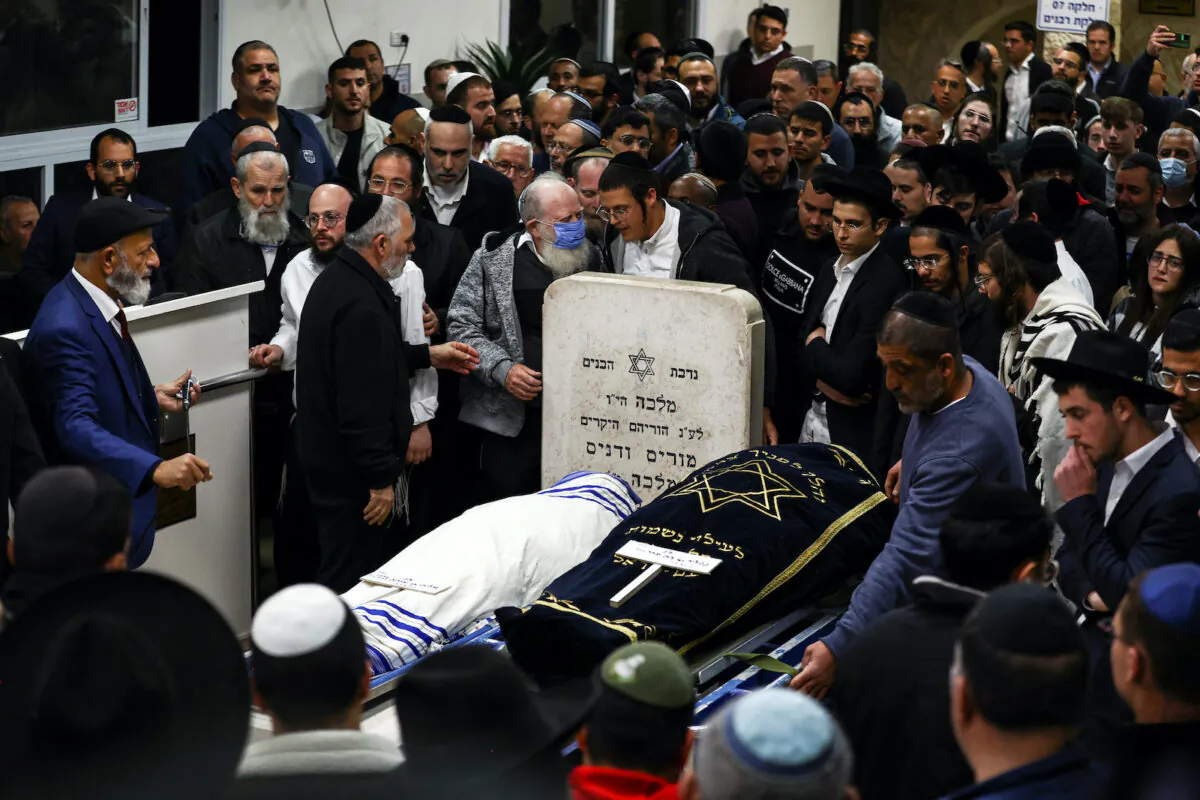 Friends and family mourn married couple Eli Mizrahi and Natali Mizrahi who were killed on Jan. 27 in a shooting attack by a Palestinian gunman on the outskirts of Jerusalem, at their funeral in Beit Shemesh, Israel Jan. 29, 2023. (Ronen Zvulun/Reuters) 