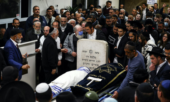 Friends and family mourn married couple Eli Mizrahi and Natali Mizrahi who were killed on Jan. 27 in a shooting attack by a Palestinian gunman on the outskirts of Jerusalem, at their funeral in Beit Shemesh, Israel Jan. 29, 2023. (Ronen Zvulun/Reuters) 