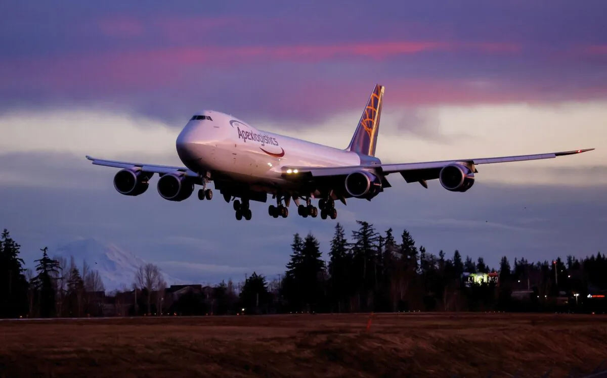 The final Boeing 747 lands at Paine Field following a test flight in Everett, Wash., on Jan. 10, 2023. (Jennifer Buchanan/The Seattle Times via AP)